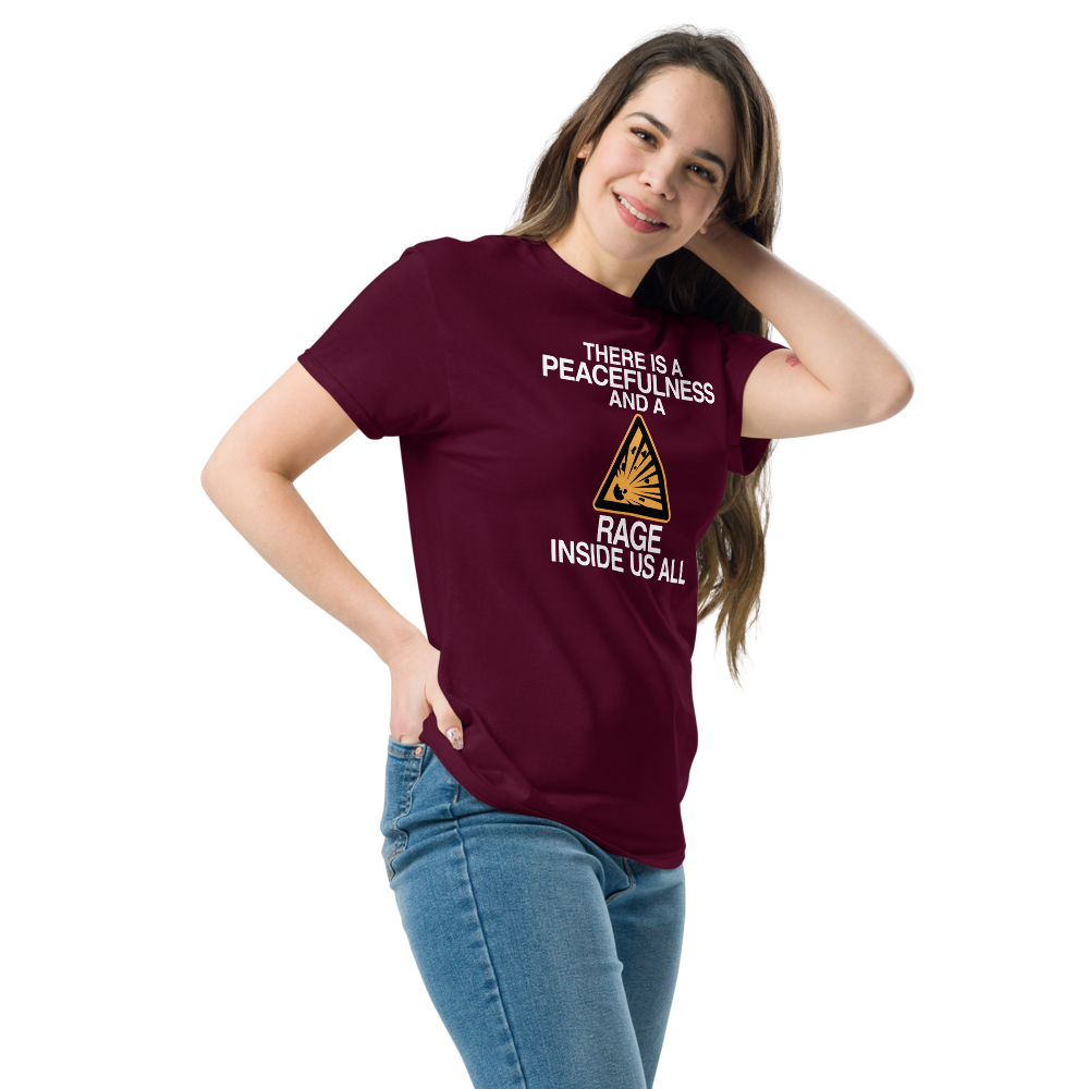 "There is a peacefulness and a rage inside us all" printed on a maroon unisex classic tee worn by a female