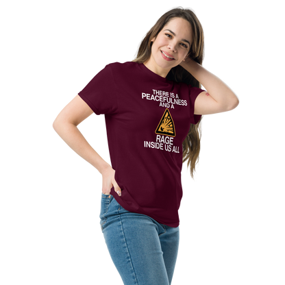 "There is a peacefulness and a rage inside us all" printed on a maroon unisex classic tee worn by a female