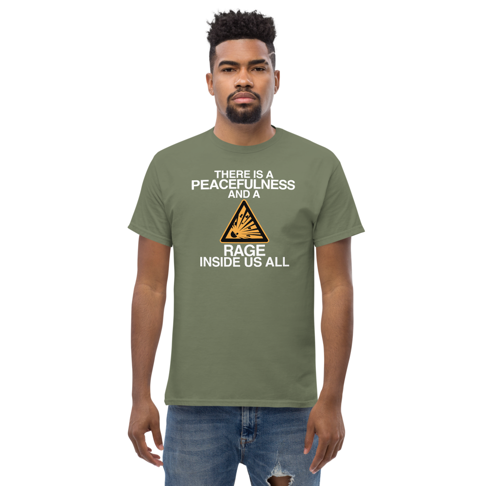 "There is a peacefulness and a rage inside us all" printed on a military green unisex classic tee worn by a male