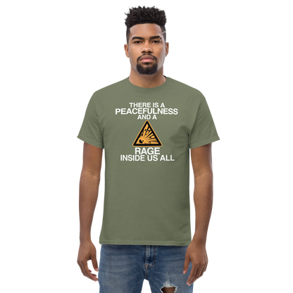 "There is a peacefulness and a rage inside us all" printed on a military green unisex classic tee worn by a male