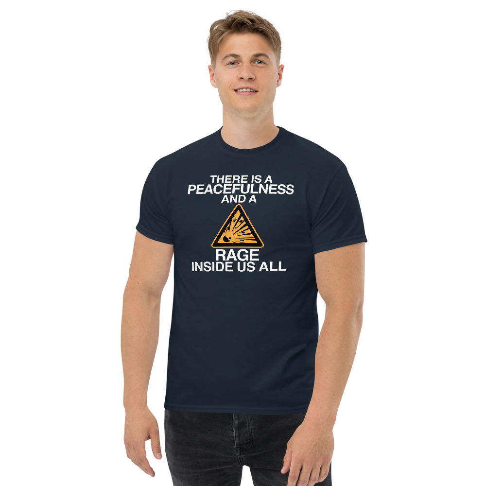"There is a peacefulness and a rage inside us all" printed on a navy unisex classic tee worn by a male