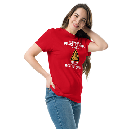 "There is a peacefulness and a rage inside us all" printed on a red unisex classic tee worn by a female