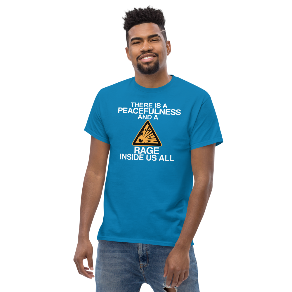 "There is a peacefulness and a rage inside us all" printed on a sapphire unisex classic tee worn by a male
