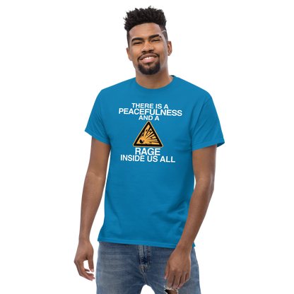 "There is a peacefulness and a rage inside us all" printed on a sapphire unisex classic tee worn by a male