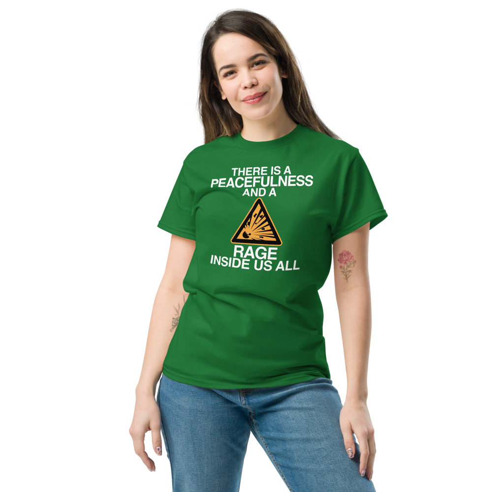 "There is a peacefulness and a rage inside us all" printed on a turf green unisex classic tee worn by a female