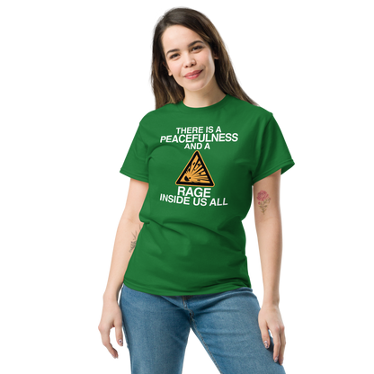 "There is a peacefulness and a rage inside us all" printed on a turf green unisex classic tee worn by a female
