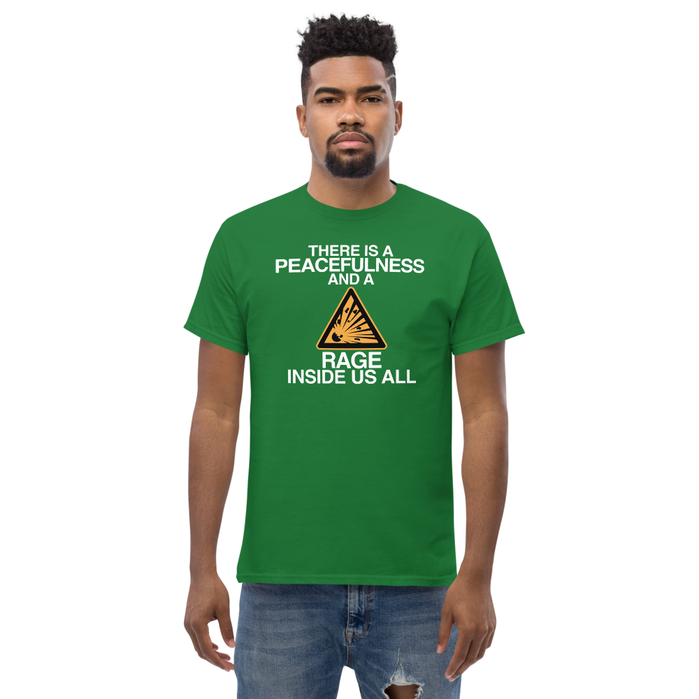 "There is a peacefulness and a rage inside us all" printed on a turf green unisex classic tee worn by a male