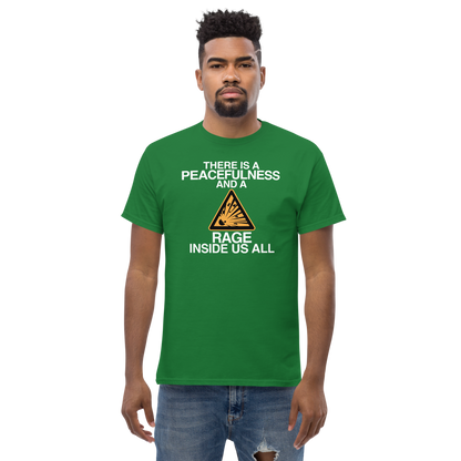 "There is a peacefulness and a rage inside us all" printed on a turf green unisex classic tee worn by a male