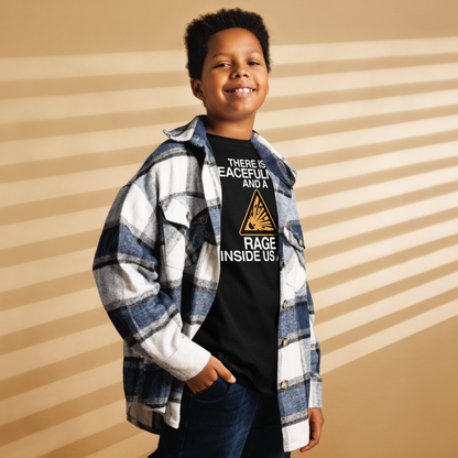 "There is a peacefulness and a rage inside us all" printed on a black youth classic tee worn by a male also wearing a jacket