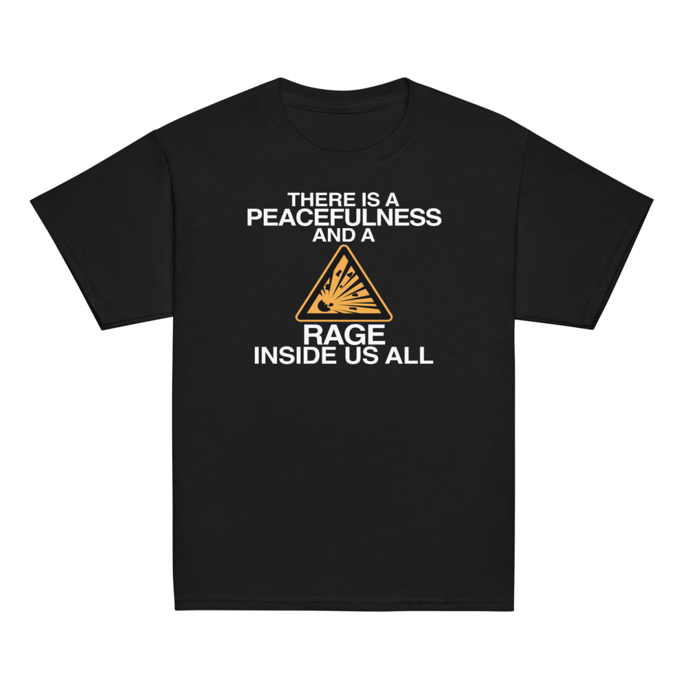 "There is a peacefulness and a rage inside us all" printed on a black youth classic tee laying on a flat surface