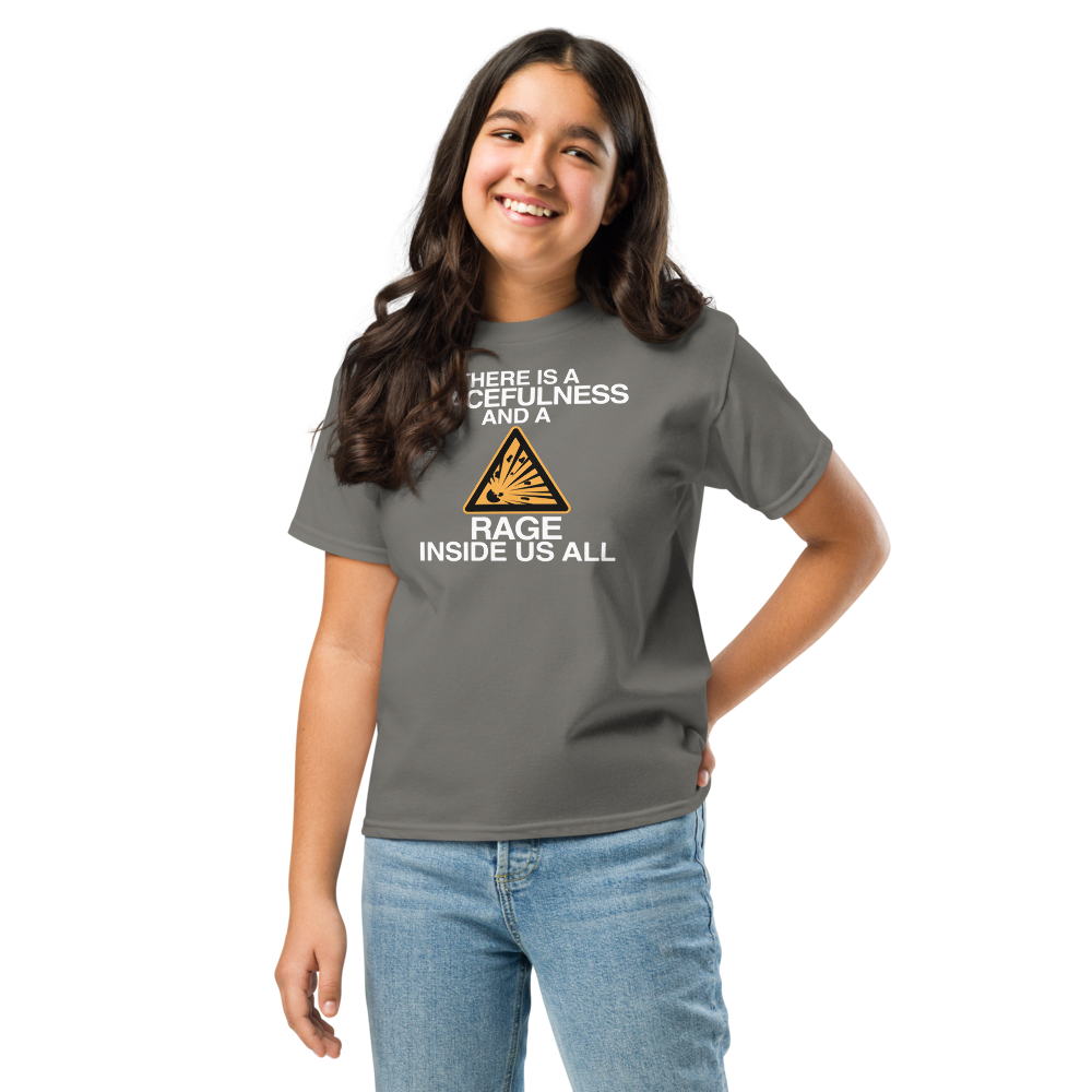 "There is a peacefulness and a rage inside us all" printed on a charcoal youth classic tee worn by a female