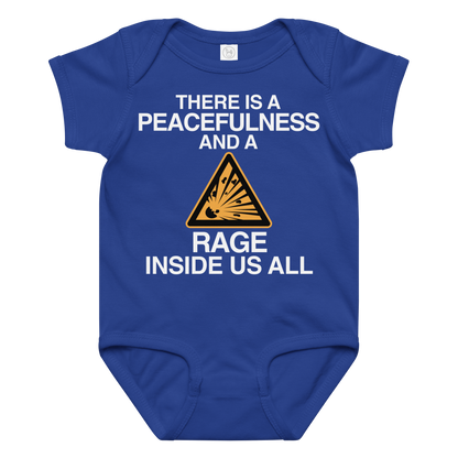 "There is a peacefulness and a rage inside us all" printed on a royal baby jersey bodysuit laying on a flat surface amongst other clothes