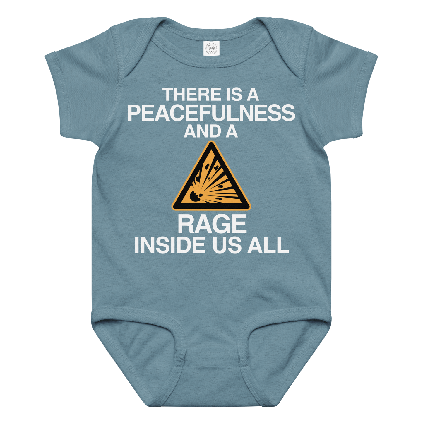 "There is a peacefulness and a rage inside us all" printed on a vintage indigo baby jersey bodysuit laying on a flat surface amongst other clothes