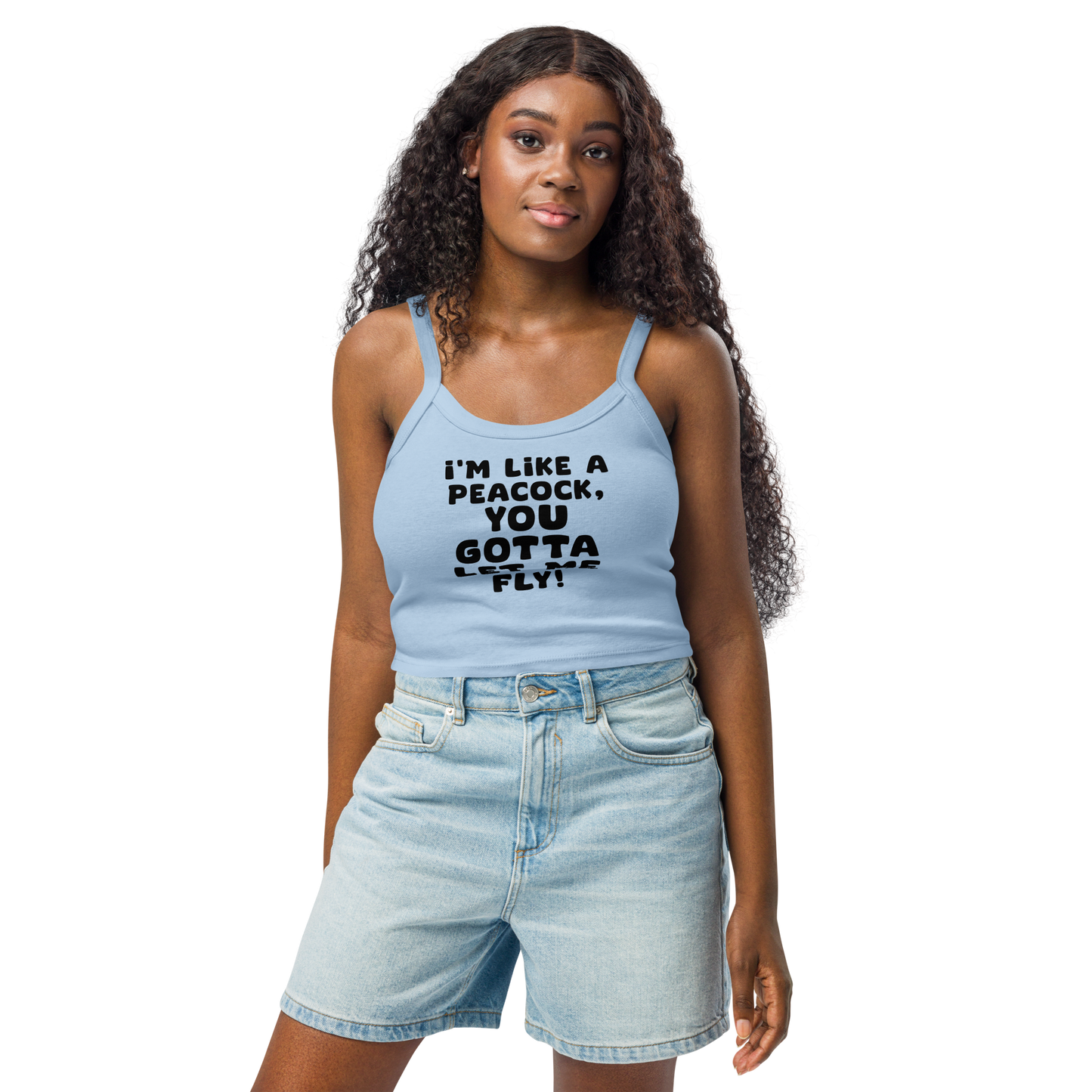 "I'm like a peacock, you gotta let me fly!" printed on a solid baby blue blend women's micro-rib tanktop worn by a female