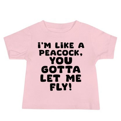 "I'm like a peacock, you gotta let me fly!" printed on a pink baby jersey short sleeve tee laying on a flat surface