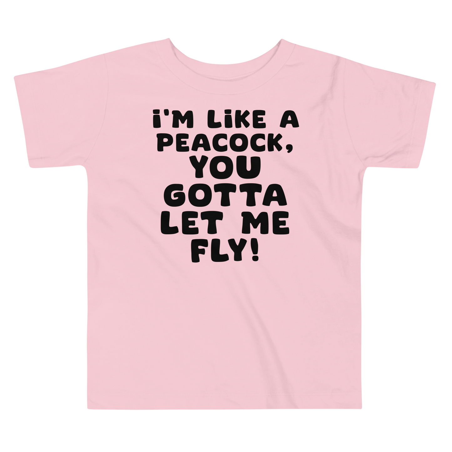 "I'm like a peacock, you gotta let me fly!" printed on a pink toddler short sleeve tee laying on a flat surface