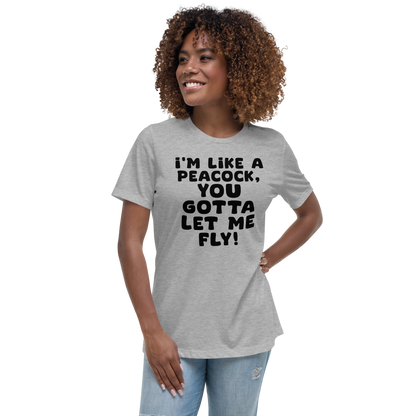 "I'm like a peacock, you gotta let me fly!" printed on a athletic heather women's relaxed t-shirt worn by a female