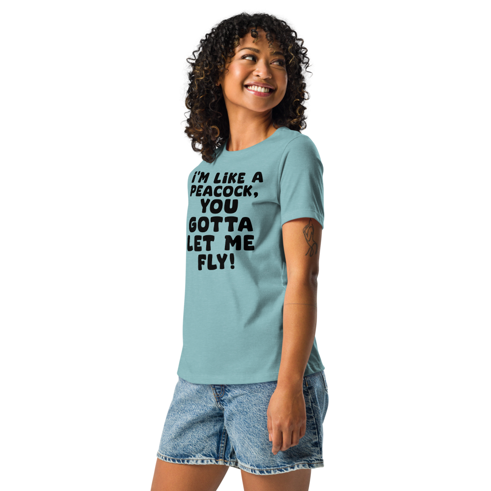 "I'm like a peacock, you gotta let me fly!" printed on a heather blue lagoon women's relaxed t-shirt worn by a female