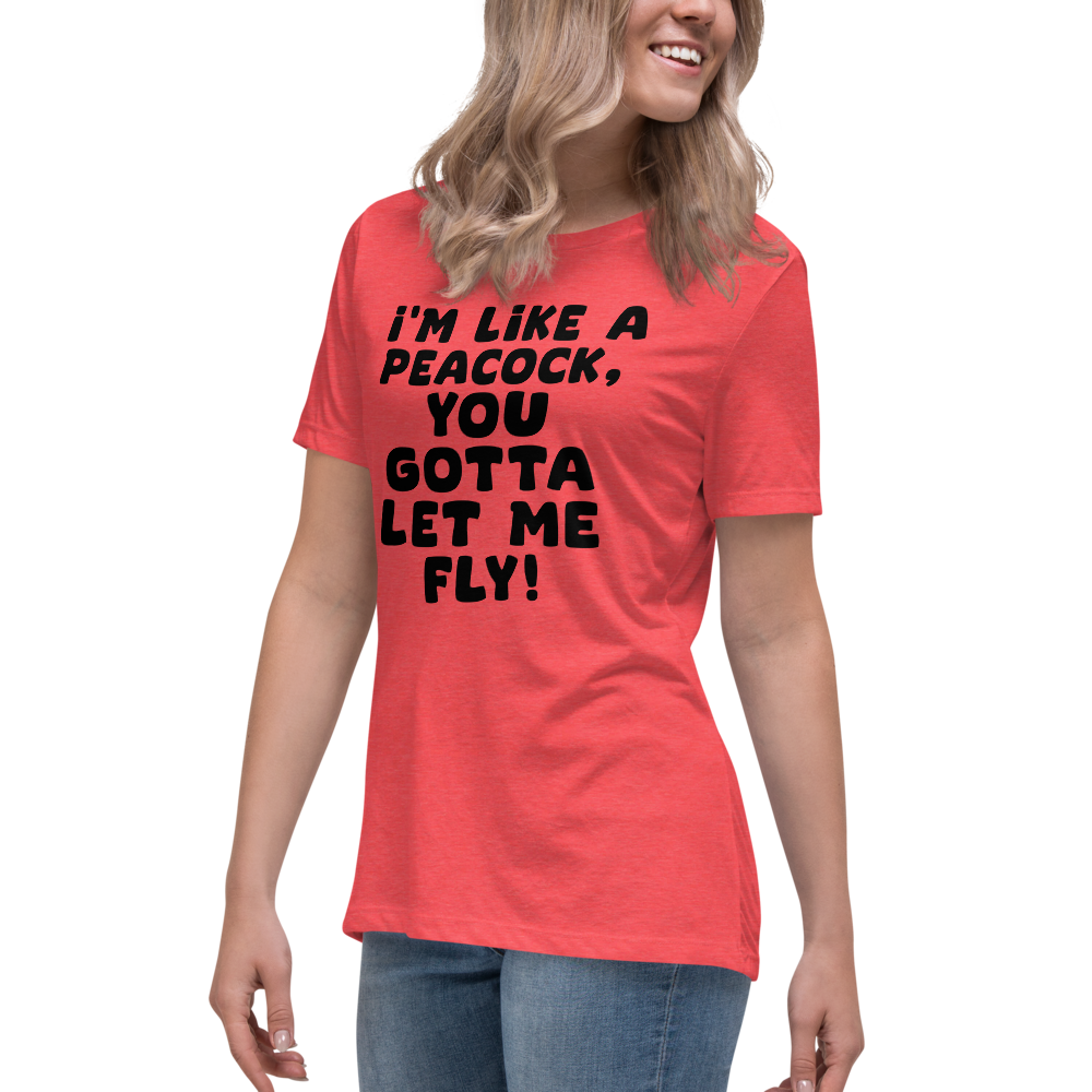 "I'm like a peacock, you gotta let me fly!" printed on a heather red women's relaxed t-shirt worn by a female