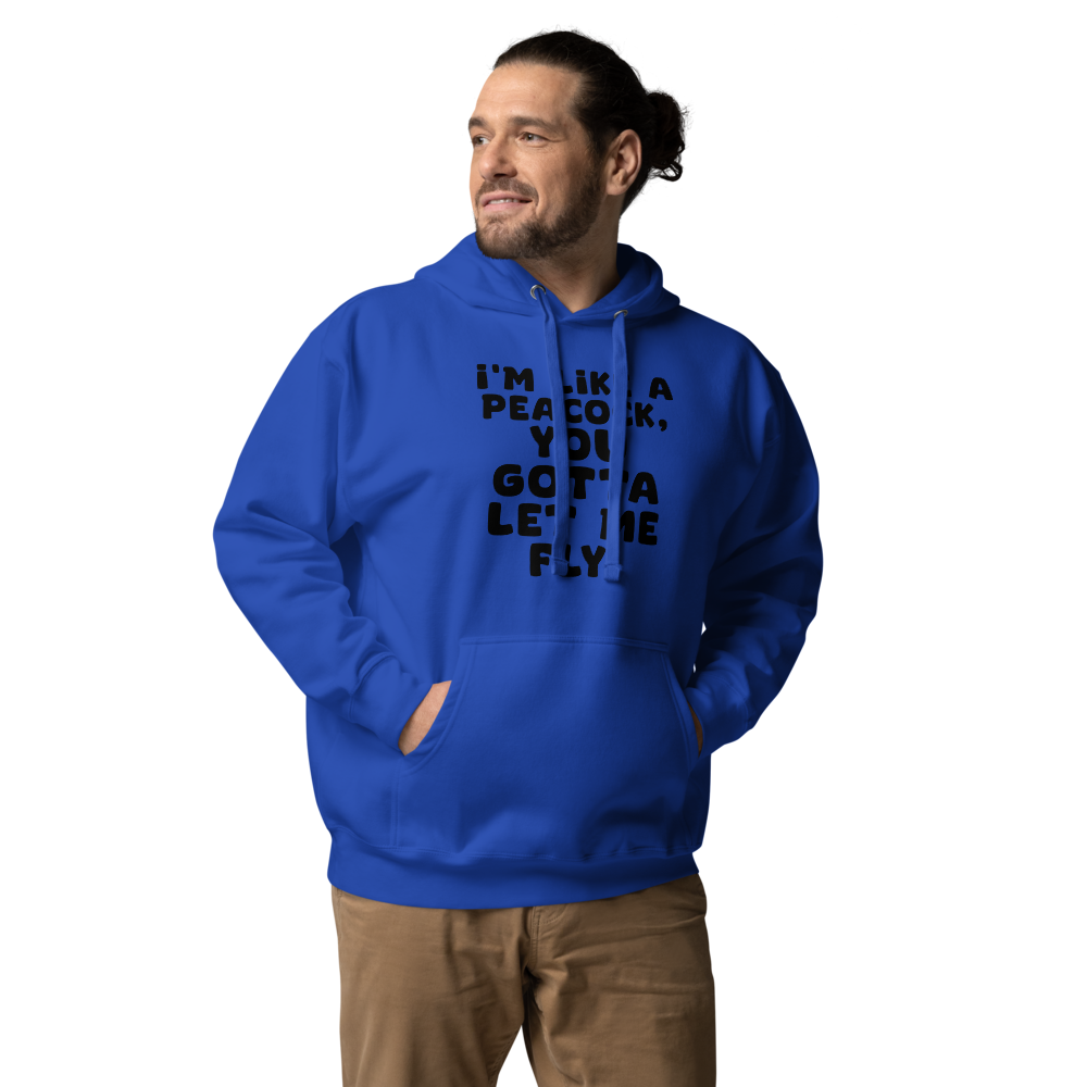 "I'm like a peacock, you gotta let me fly!" printed on a team royal unisex hoodie worn by a male