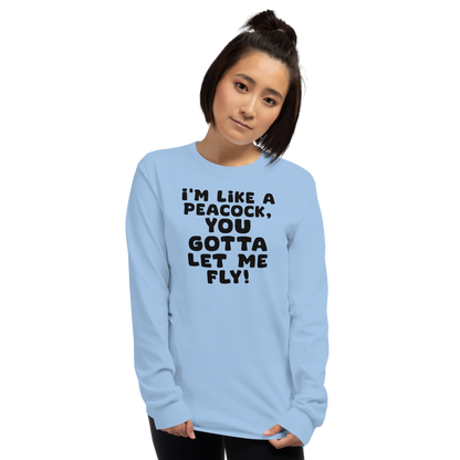 "I'm like a peacock, you gotta let me fly!" printed on a light blue men's long sleeve shirt worn by a female