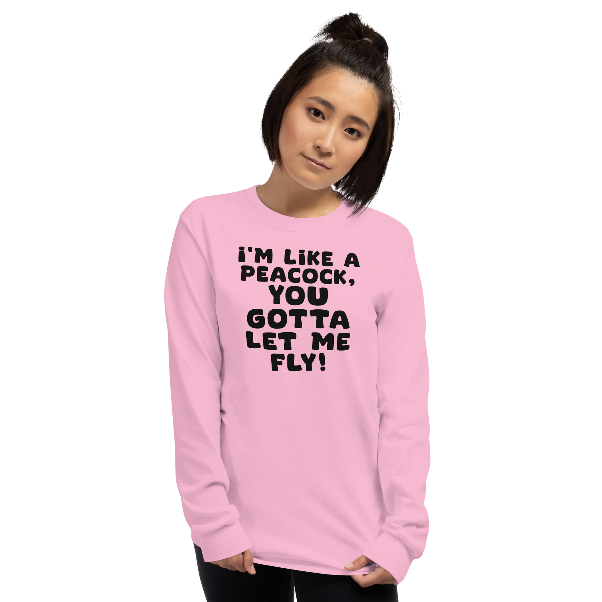 "I'm like a peacock, you gotta let me fly!" printed on a light pink men's long sleeve shirt worn by a female