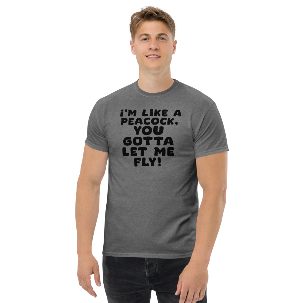 "I'm like a peacock, you gotta let me fly!" printed on a graphite heather unisex classic tee worn by a male