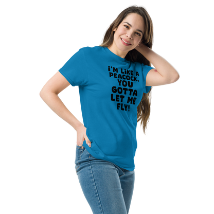 "I'm like a peacock, you gotta let me fly!" printed on a sapphire unisex classic tee worn by a female