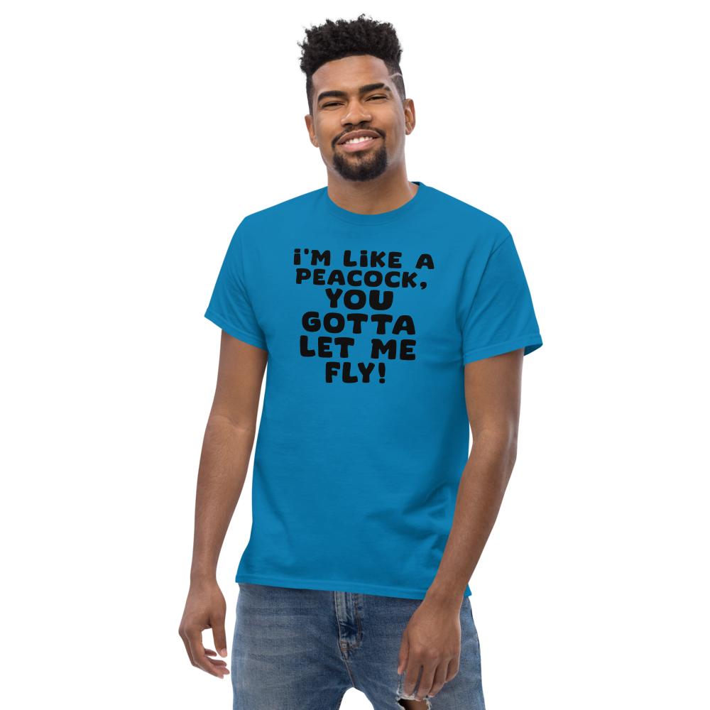 "I'm like a peacock, you gotta let me fly!" printed on a sapphire unisex classic tee worn by a male