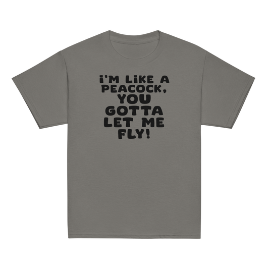 "I'm like a peacock, you gotta let me fly!" printed on a charcoal youth classic tee laying on a flat surface