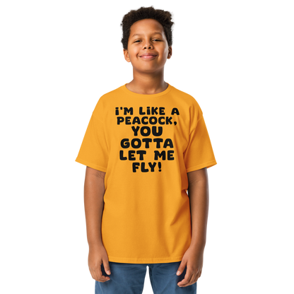 "I'm like a peacock, you gotta let me fly!" printed on a gold youth classic tee worn by a male