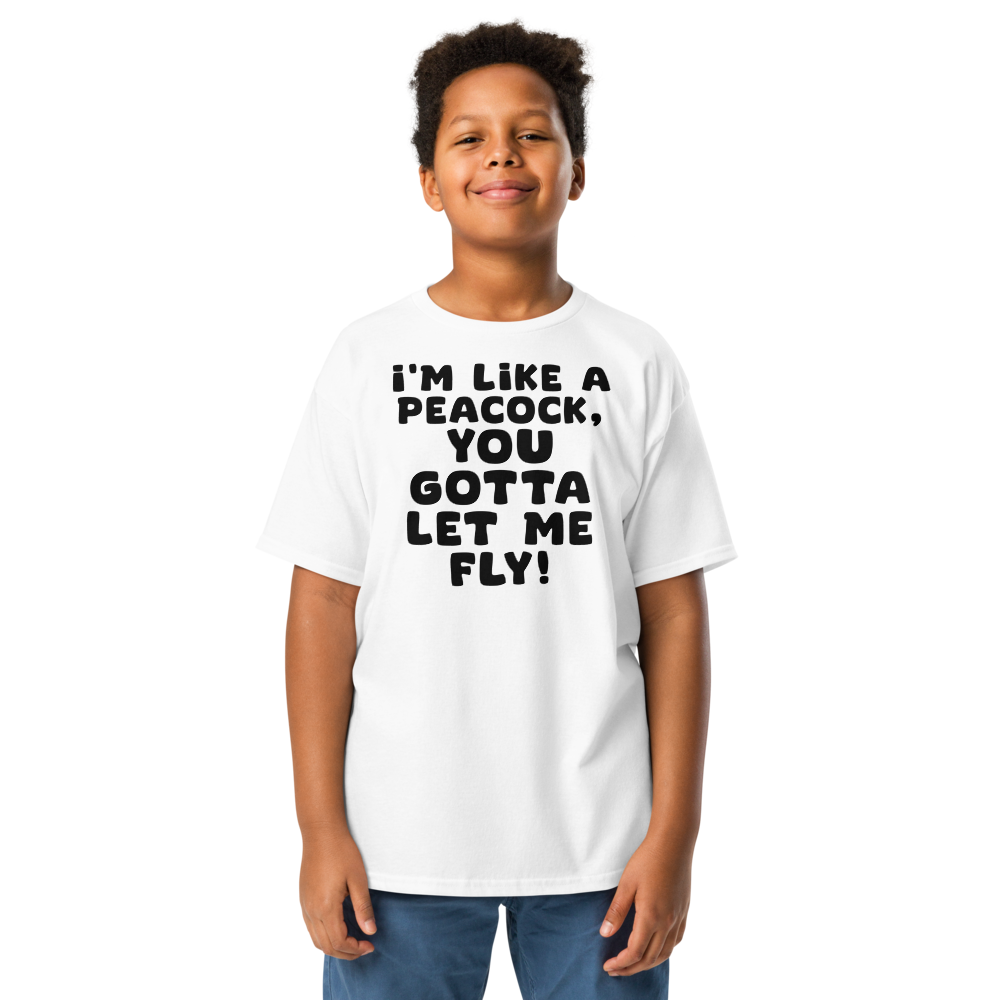 "I'm like a peacock, you gotta let me fly!" printed on a white youth classic tee worn by a male