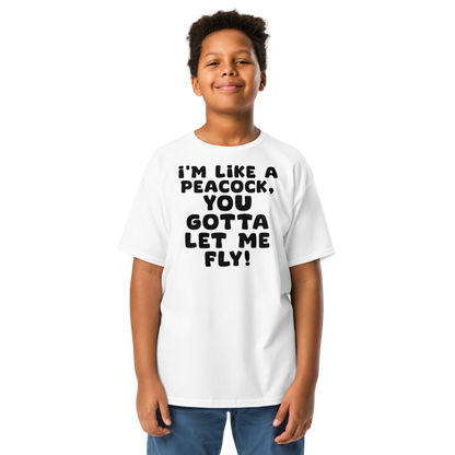 "I'm like a peacock, you gotta let me fly!" printed on a white youth classic tee worn by a male