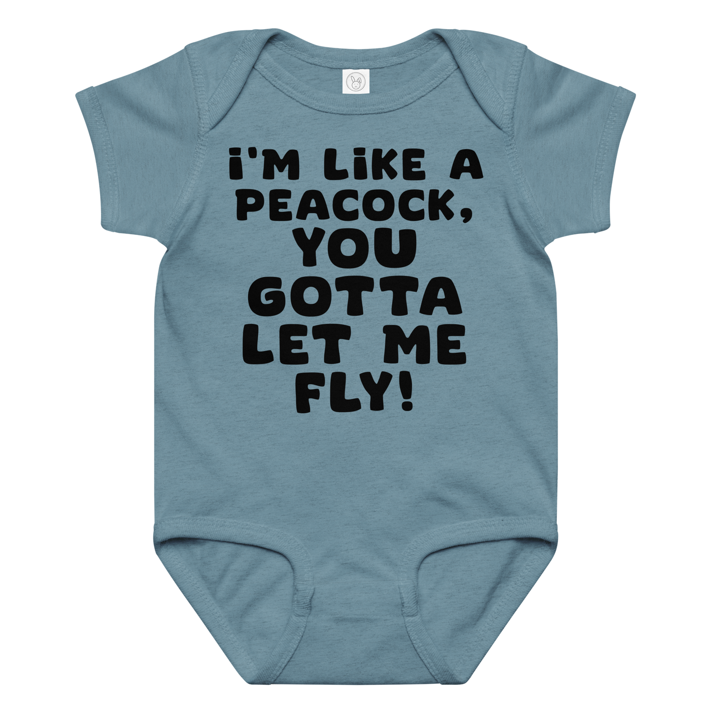 "I'm like a peacock, you gotta let me fly!" printed on a vintage indigo baby jersey bodysuit laying on a flat surface amongst other clothes