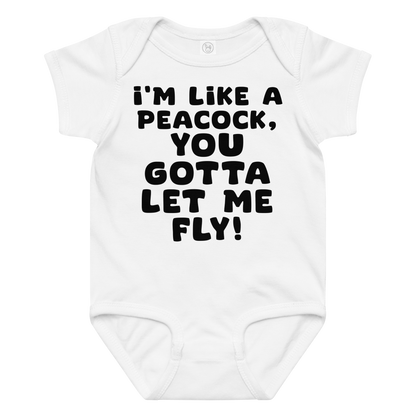 "I'm like a peacock, you gotta let me fly!" printed on a white baby jersey bodysuit laying on a flat surface amongst other clothes