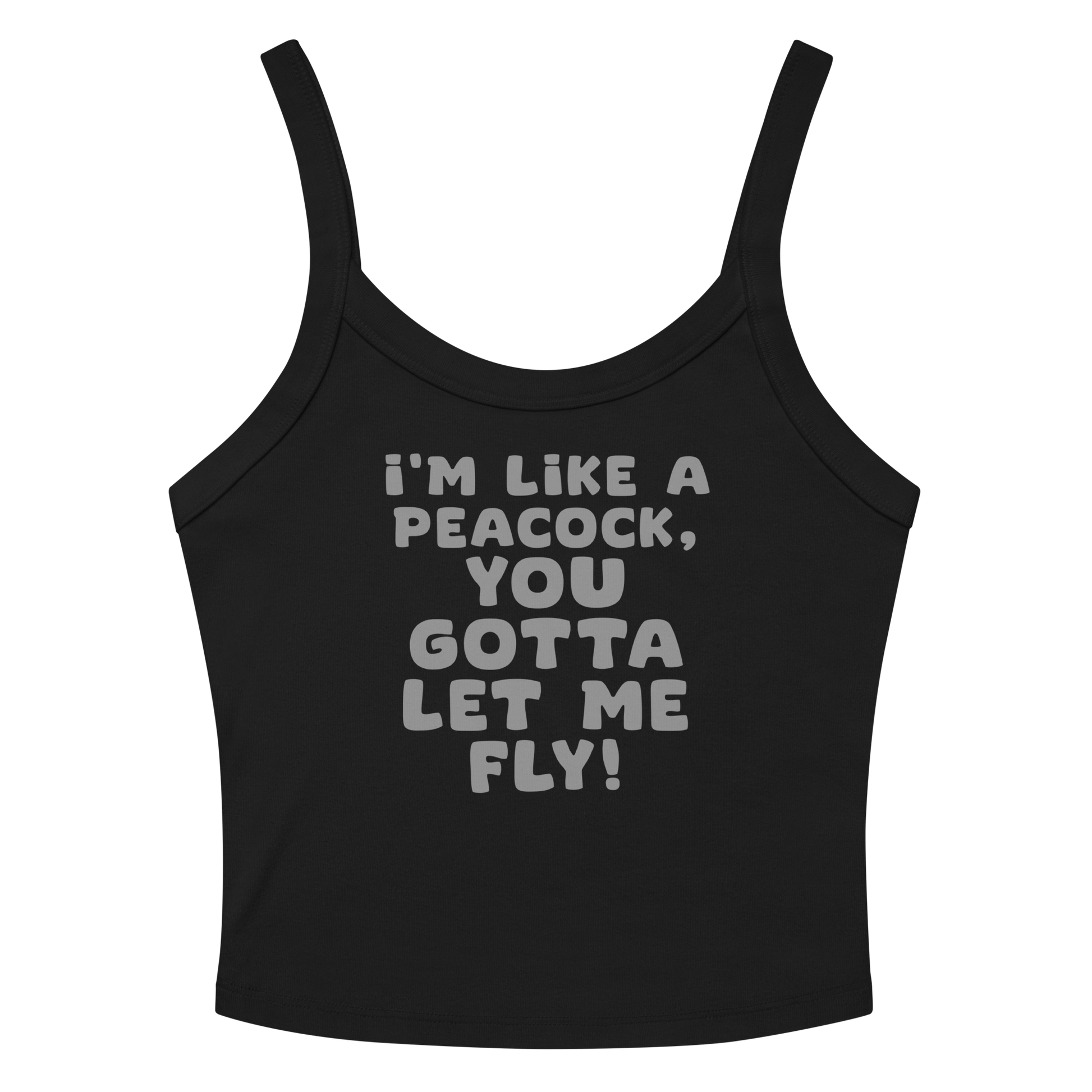 "I'm like a peacock, you gotta let me fly!" printed on a solid black blend women's micro-rib tanktop laying on a flat surface amongst sunglasses and shorts