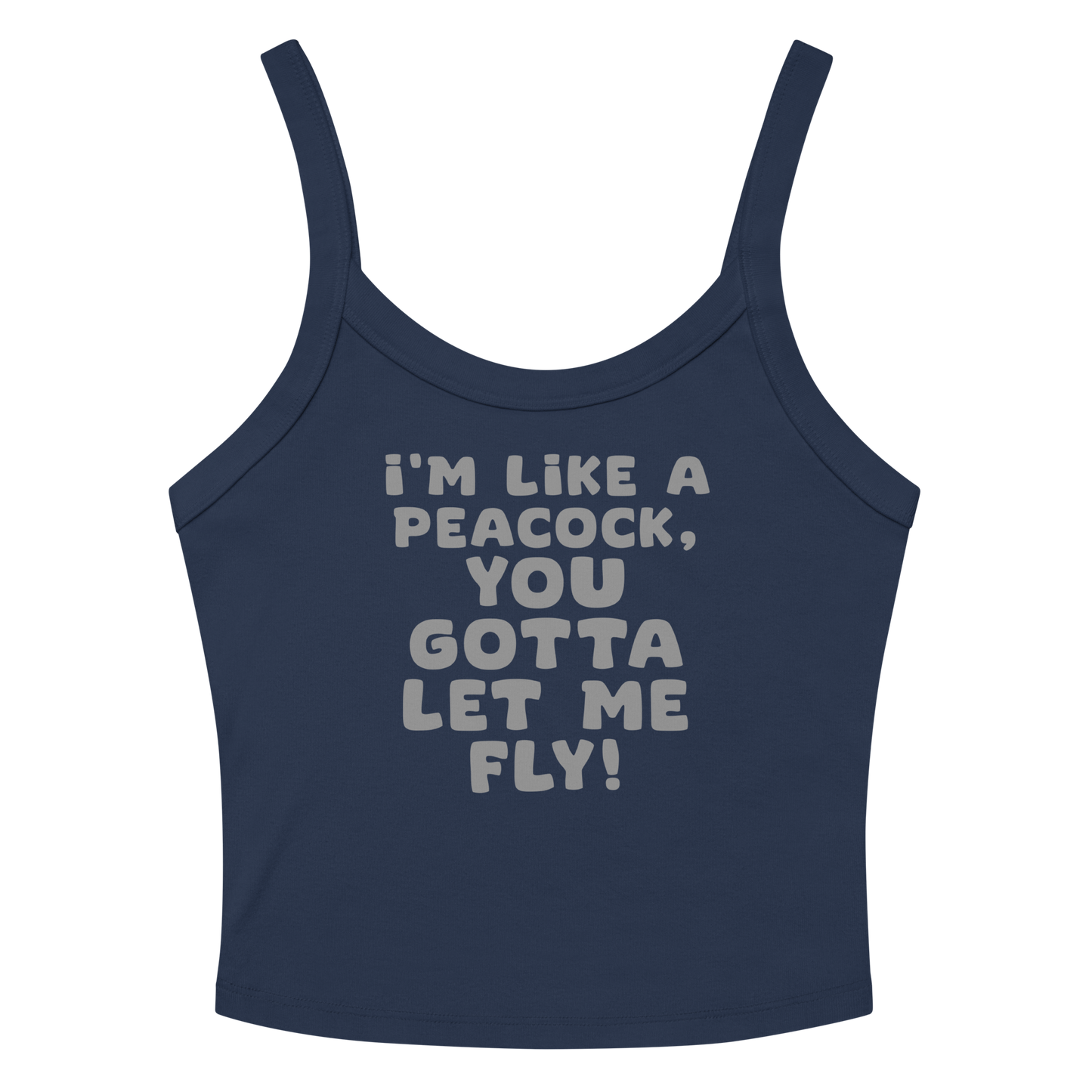 "I'm like a peacock, you gotta let me fly!" printed on a solid navy blend women's micro-rib tanktop laying on a flat surface amongst sunglasses and shorts
