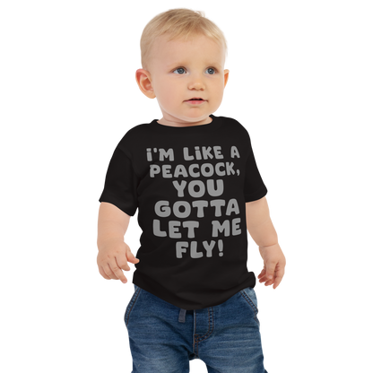 "I'm like a peacock, you gotta let me fly!" printed on a black baby jersey short sleeve tee worn by a male