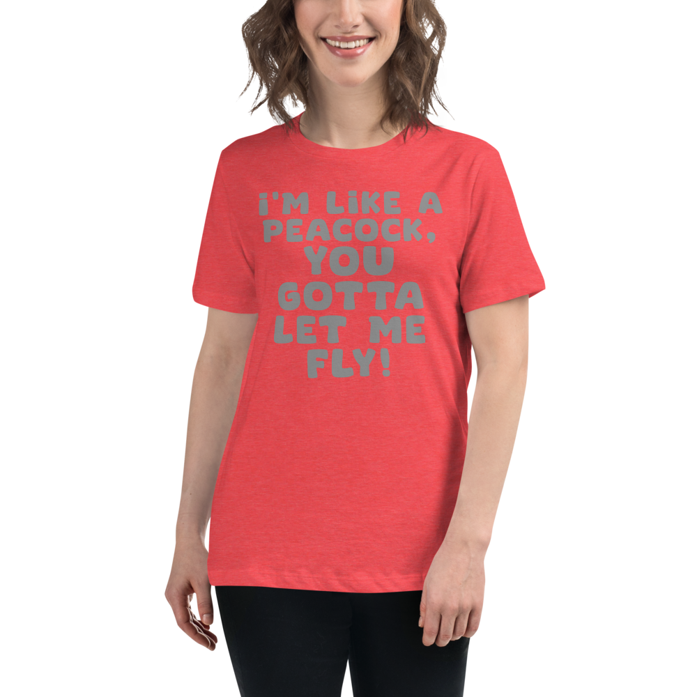 "I'm like a peacock, you gotta let me fly!" printed on a heather red women's relaxed t-shirt worn by a female