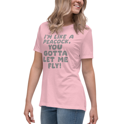 "I'm like a peacock, you gotta let me fly!" printed on a pink women's relaxed t-shirt worn by a female