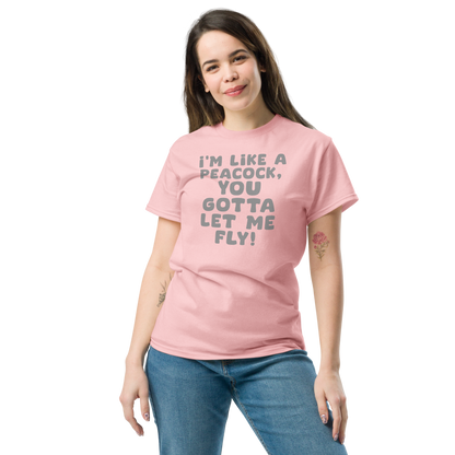 "I'm like a peacock, you gotta let me fly!" printed on a light pink unisex classic tee worn by a female