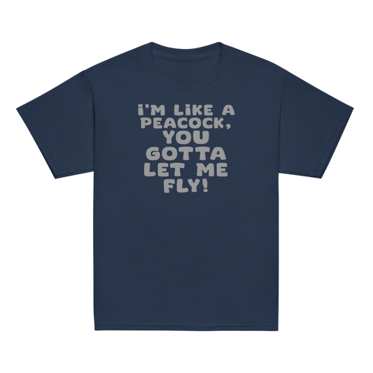 "I'm like a peacock, you gotta let me fly!" printed on a navy youth classic tee laying on a flat surface