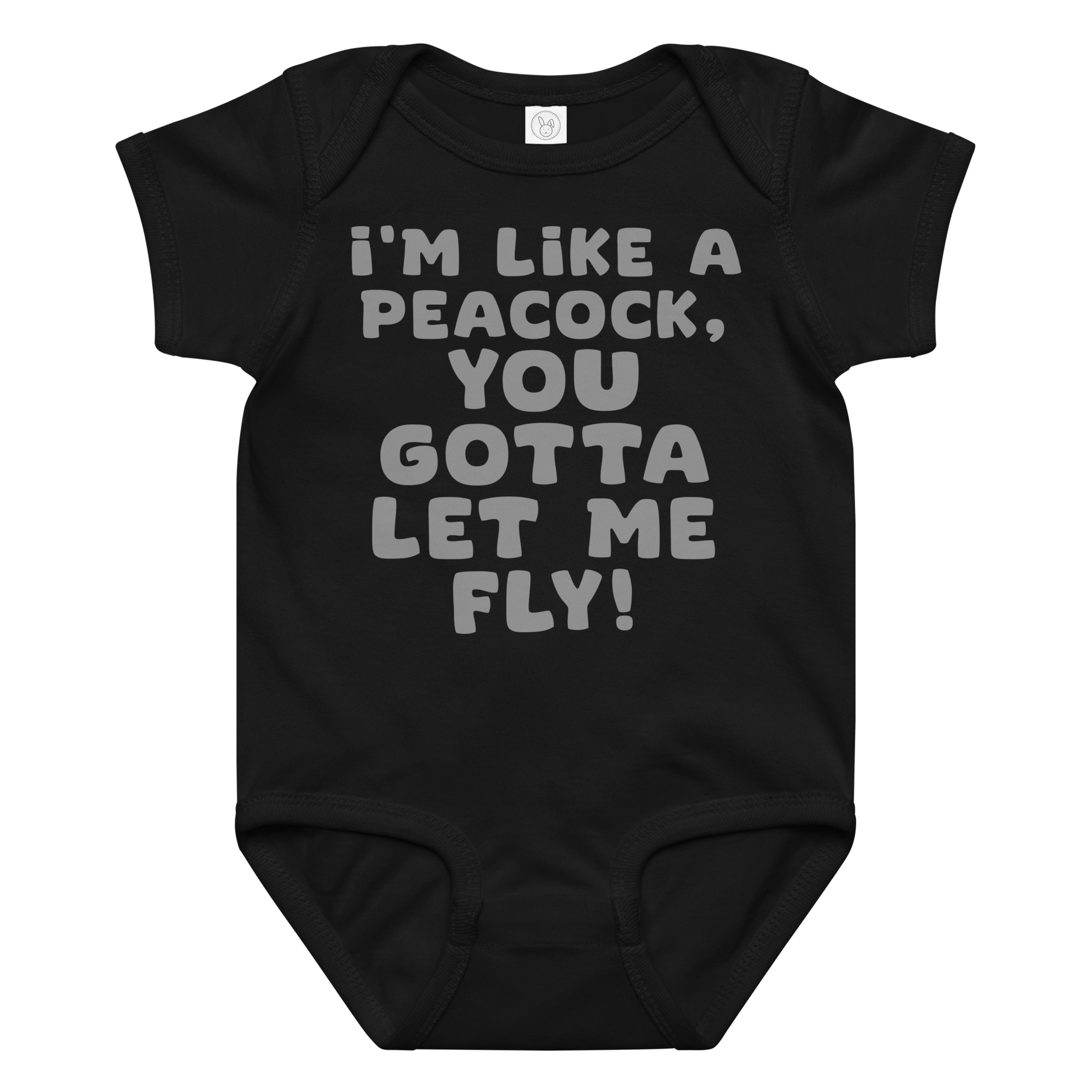 "I'm like a peacock, you gotta let me fly!" printed on a black baby jersey bodysuit laying on a flat surface amongst other clothes