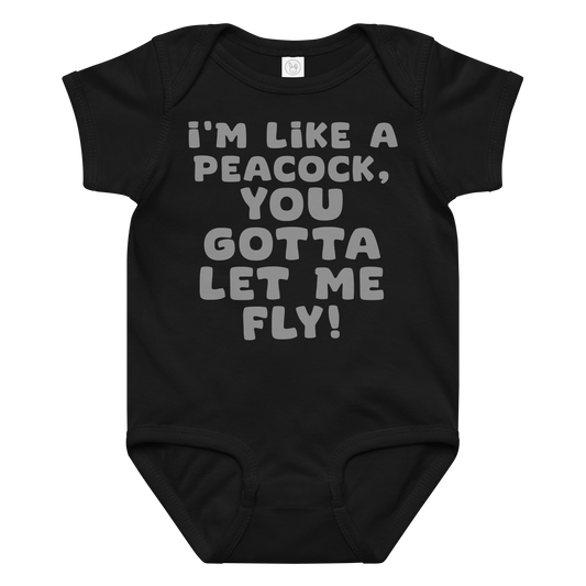 "I'm like a peacock, you gotta let me fly!" printed on a black baby jersey bodysuit laying on a flat surface amongst other clothes