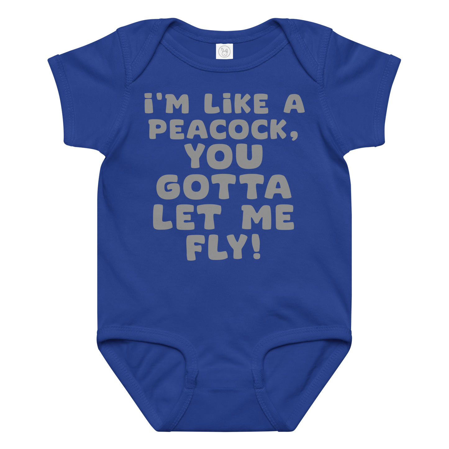 "I'm like a peacock, you gotta let me fly!" printed on a royal baby jersey bodysuit laying on a flat surface amongst other clothes