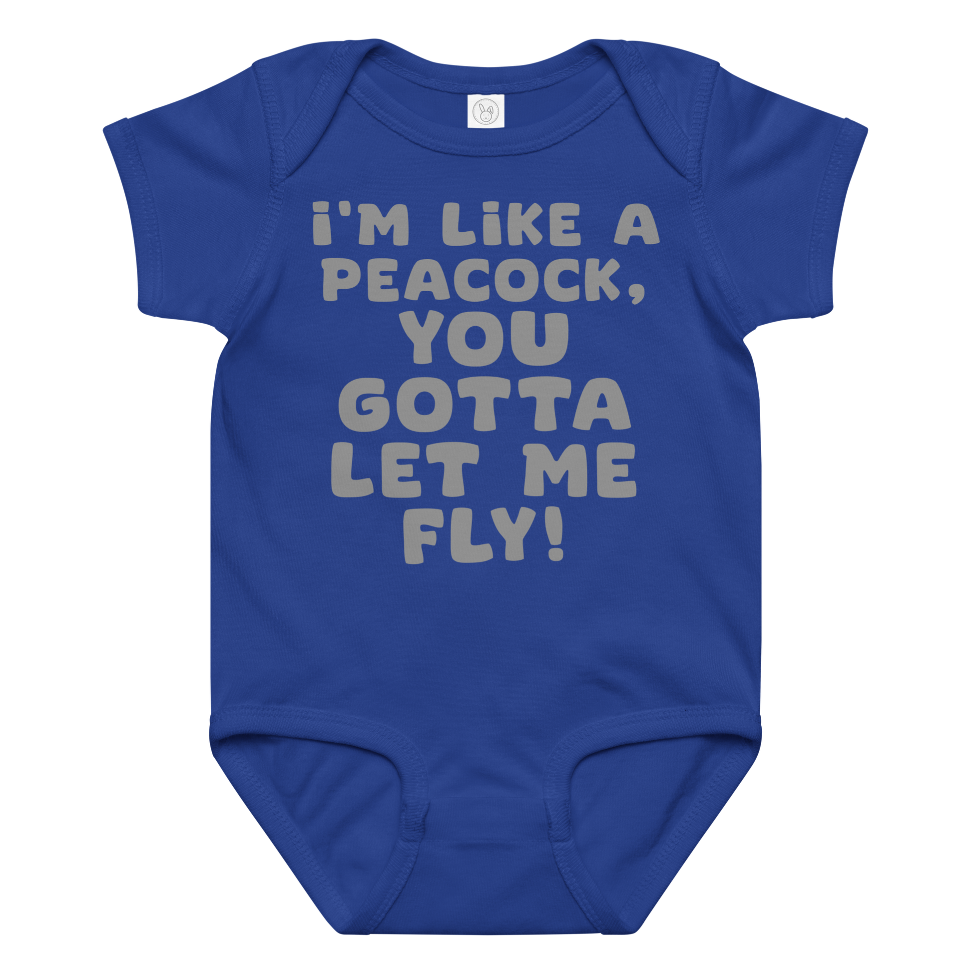 "I'm like a peacock, you gotta let me fly!" printed on a royal baby jersey bodysuit laying on a flat surface amongst other clothes
