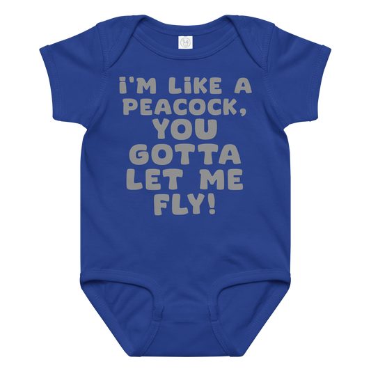"I'm like a peacock, you gotta let me fly!" printed on a royal baby jersey bodysuit laying on a flat surface amongst other clothes