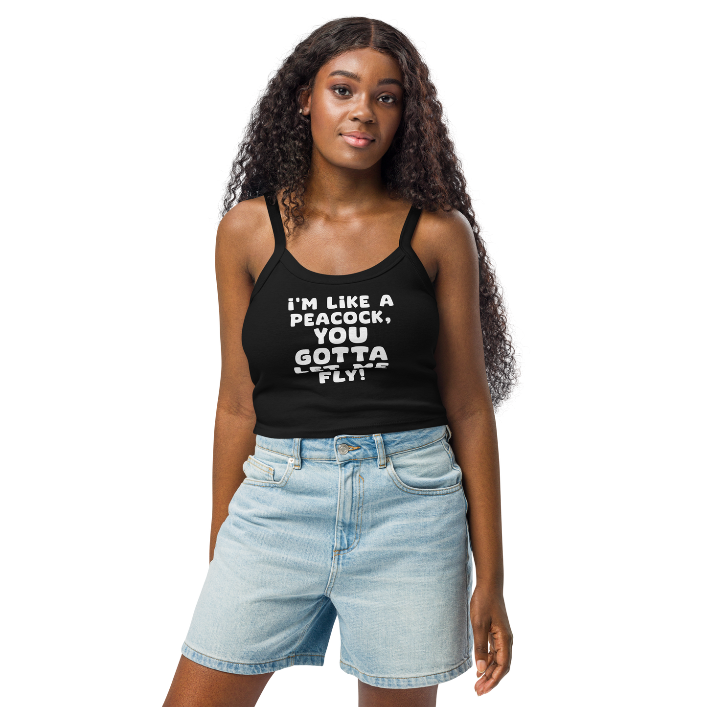 "I'm like a peacock, you gotta let me fly!" printed on a solid black blend women's micro-rib tanktop worn by a female