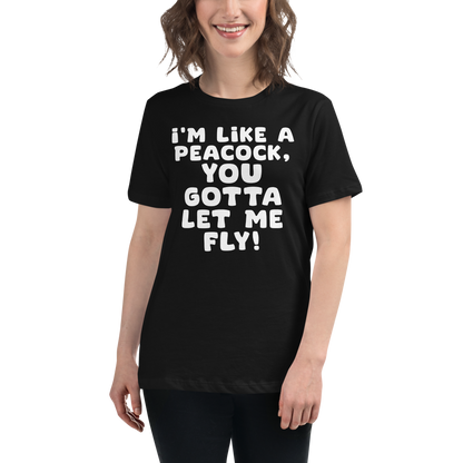 "I'm like a peacock, you gotta let me fly!" printed on a black women's relaxed t-shirt worn by a female