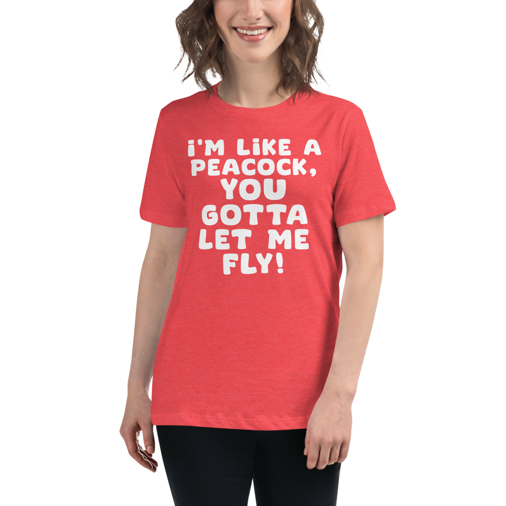 "I'm like a peacock, you gotta let me fly!" printed on a heather red women's relaxed t-shirt worn by a female